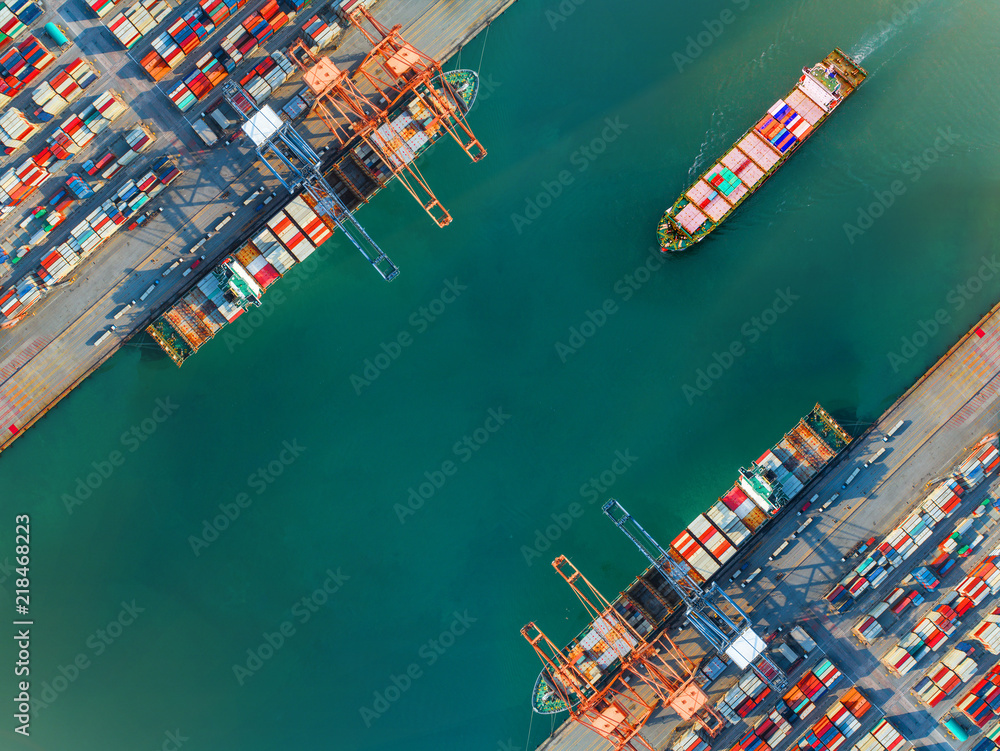 container port terminal keep busy and congestion by the ships vessels are working operation in transfer cantainers cargo shipment, transport and logistics services to global Worldwide