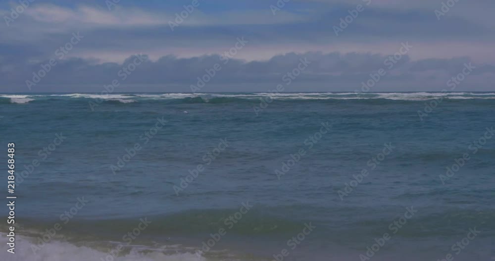 Waves along the shoreline of a beach. Waves along the shoreline of a beach.