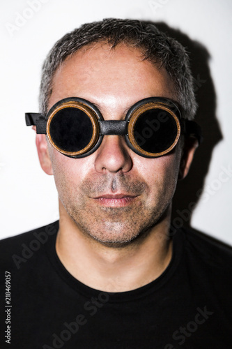 Man in steampunk glasseses on white background