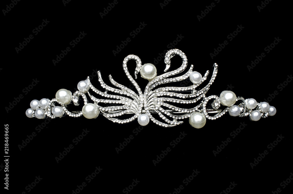 silver diadem with swans isolated on black silver diadem with swans isolated on black