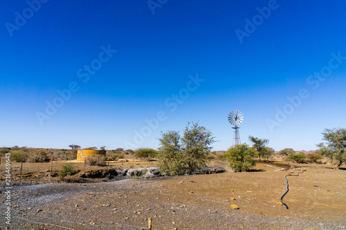 Canvas Print Windmill in the desert of namibia