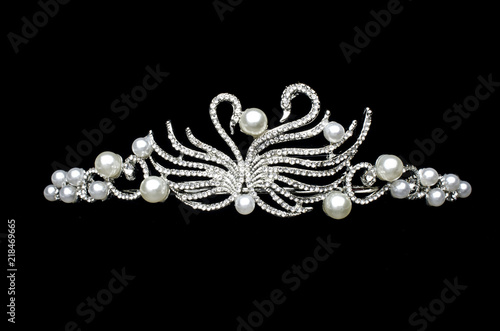 silver diadem with swans isolated on black
