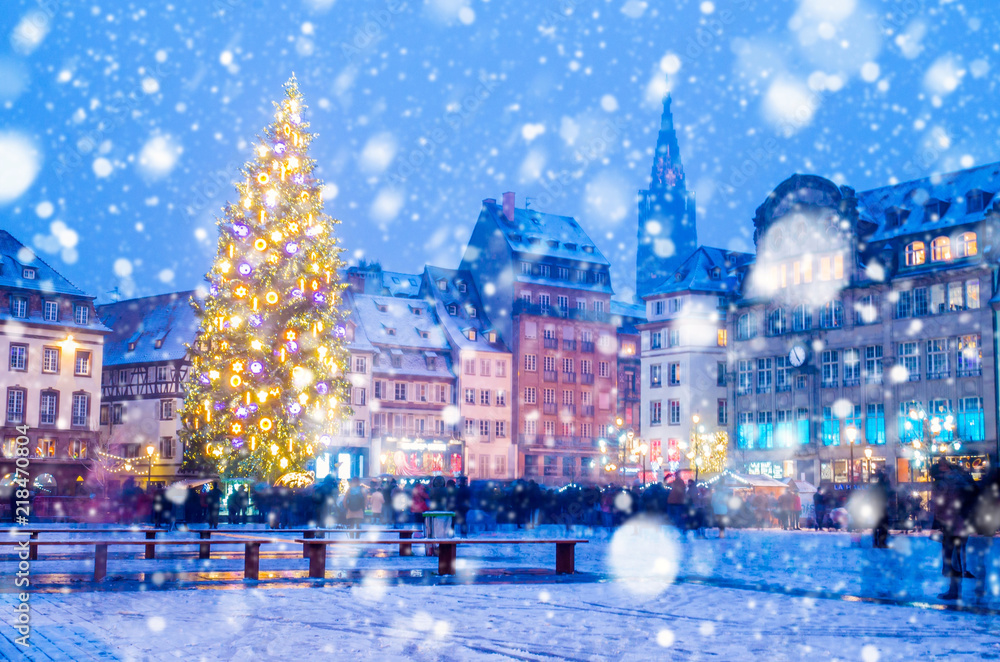 Christmas market under the snow in France, in Strasbourg, Alsace Christmas market under the snow in France, in Strasbourg, Alsace