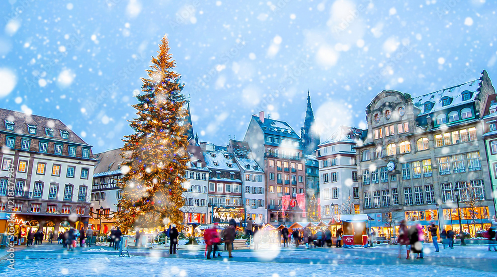 Christmas market under the snow in France, in Strasbourg, Alsace