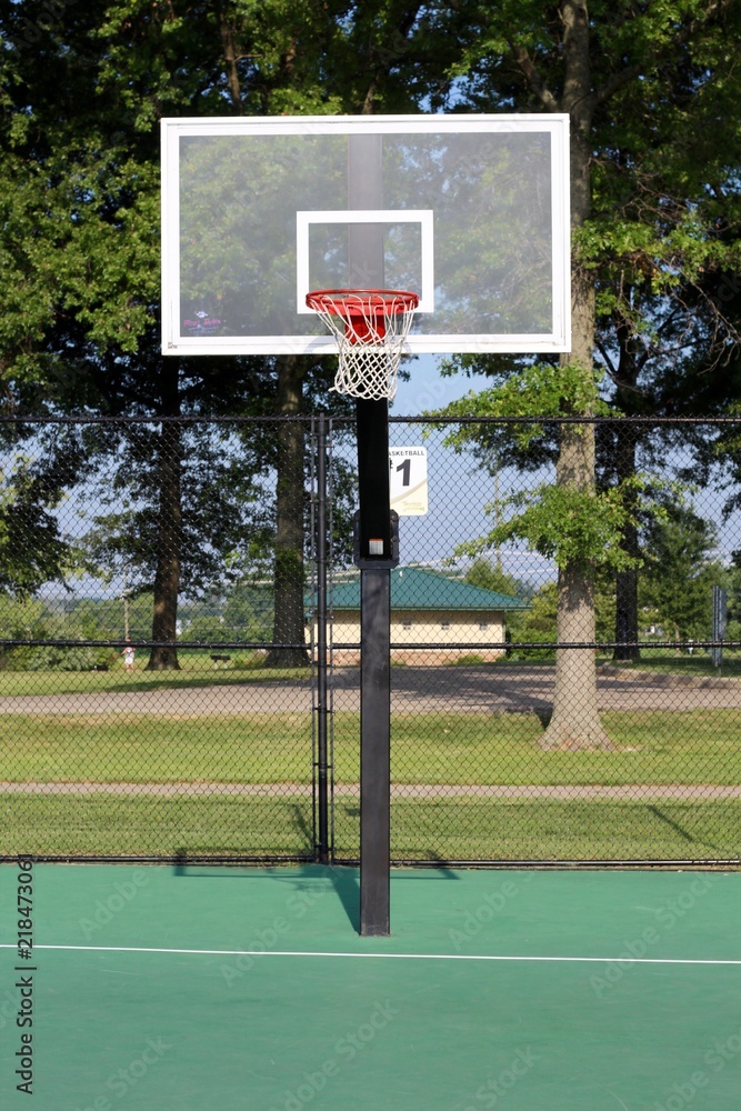 The basketball hoop on the outdoor basketball court. Stock Photo | Adobe  Stock