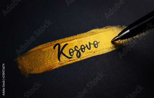 Kosovo Handwriting Text on Golden Paint Brush Stroke