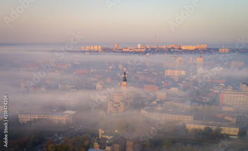 Fog above city of the center. Kharkiv churches are covered with the fog in the city center. Aerial view on the city of Kharkiv, Ukraine.