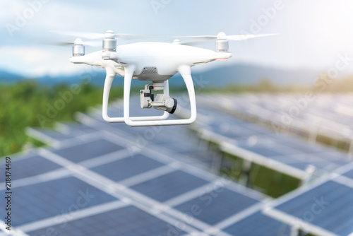 Drones flying over solar cells.Survey concept