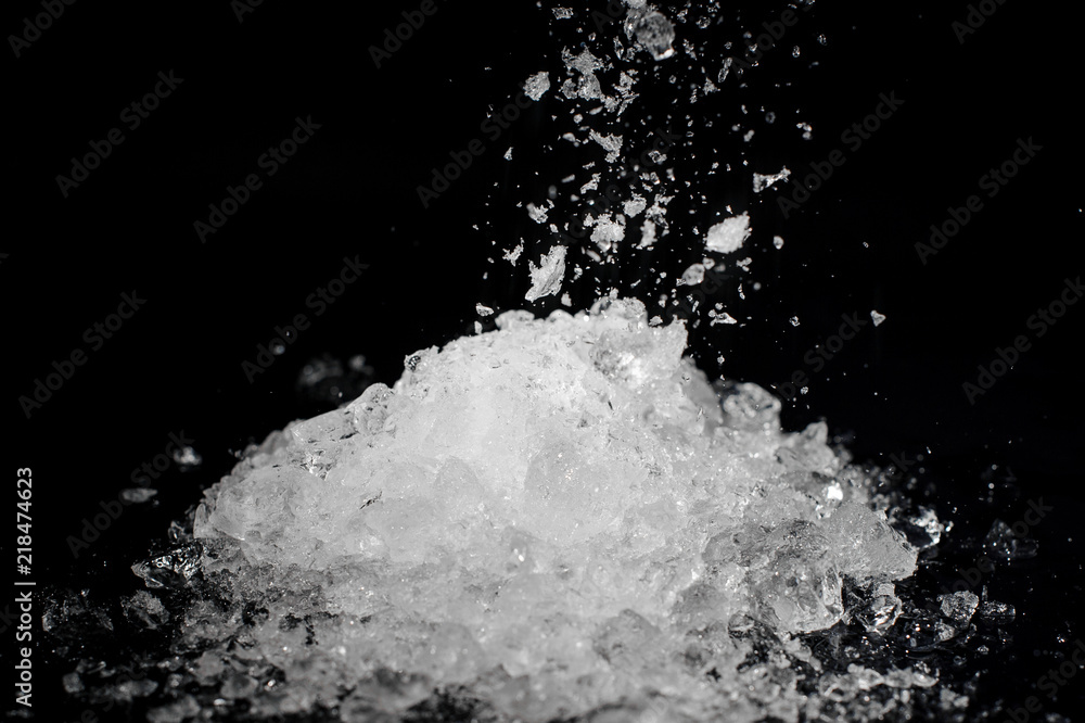 Pile of crushed white ice on black background Pile of crushed white ice on black background