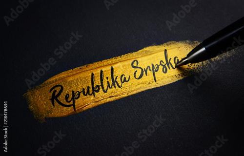 Republika Srpska Handwriting Text on Golden Paint Brush Stroke