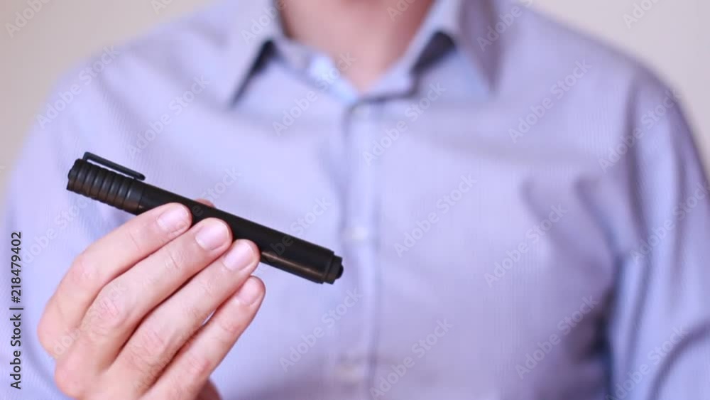 Black and red markers in male hands Black and red markers in male hands