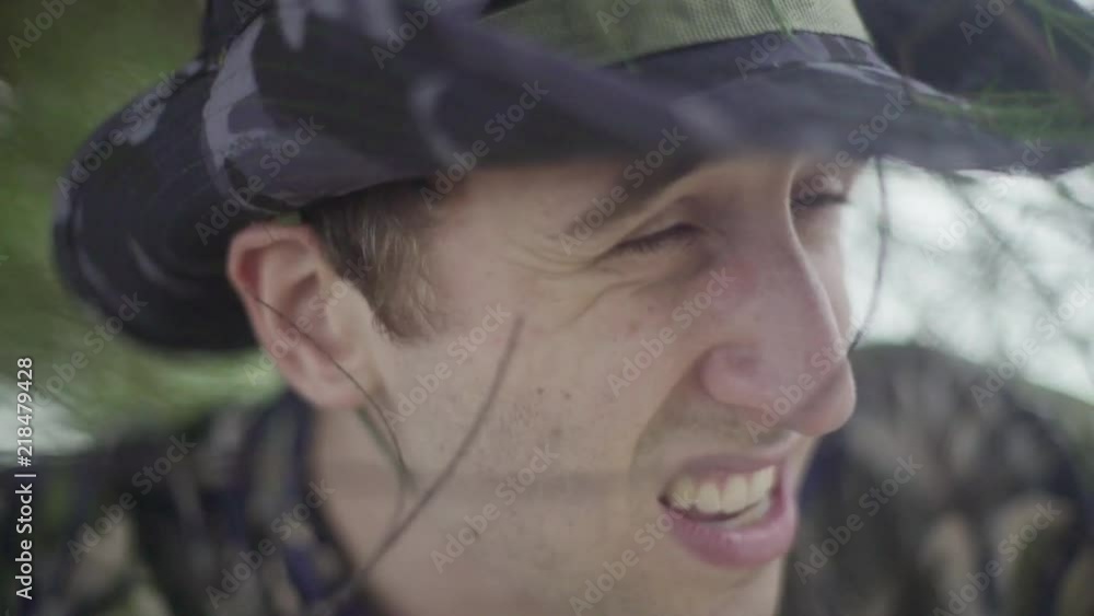 Young male explorer lost in tropical jungle scans his surroundings Young male explorer lost in tropical jungle scans his surroundings