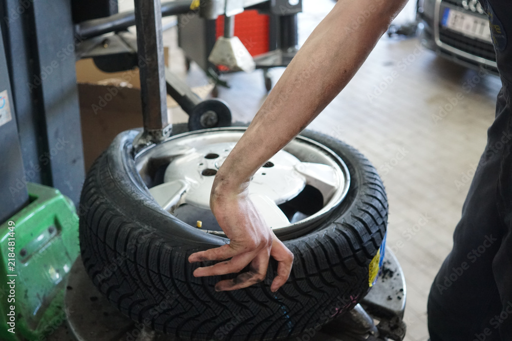 Tyre repairing in a garage Tyre repairing in a garage
