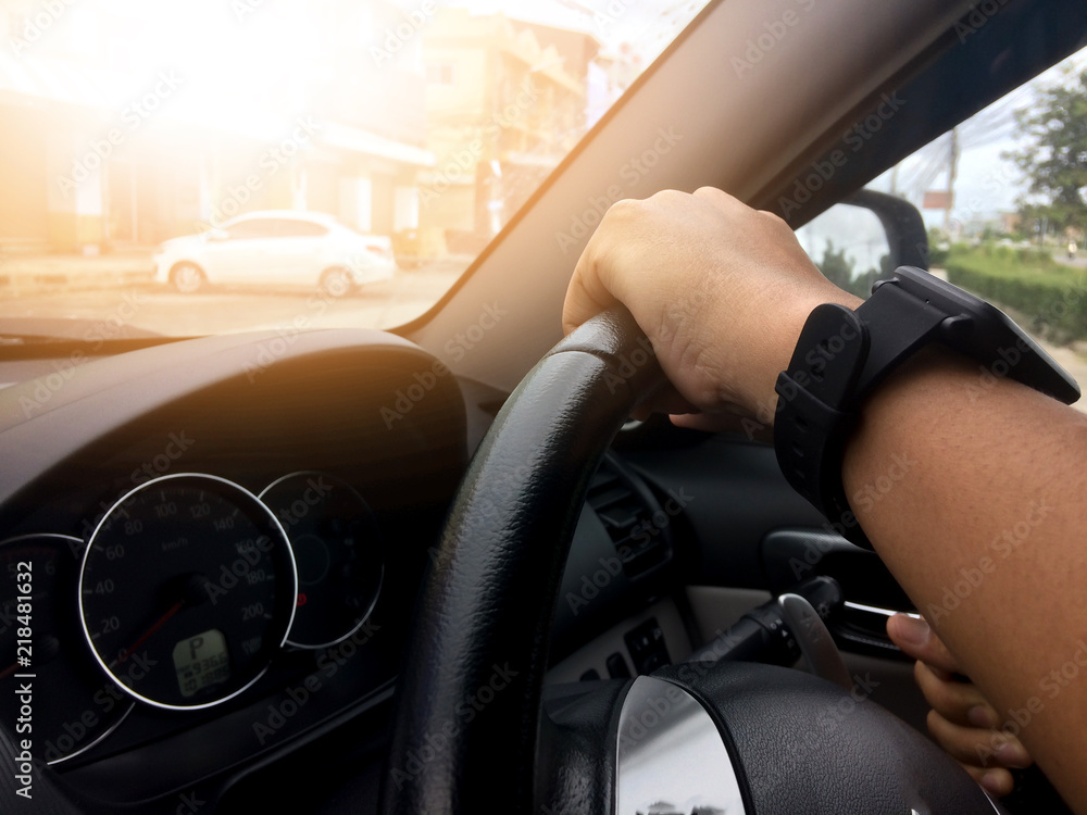 Fototapeta premium Hand of man driving inside car.