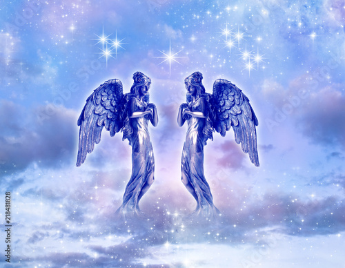 two angels or archangels angel archangel Gabriel, Ariel, Hanilel with dove over mystical sky with stars 