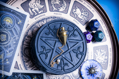 horoscope with zodiac signs, astrology dice, pendulum, pentagram and cars like esoteric concept  photo