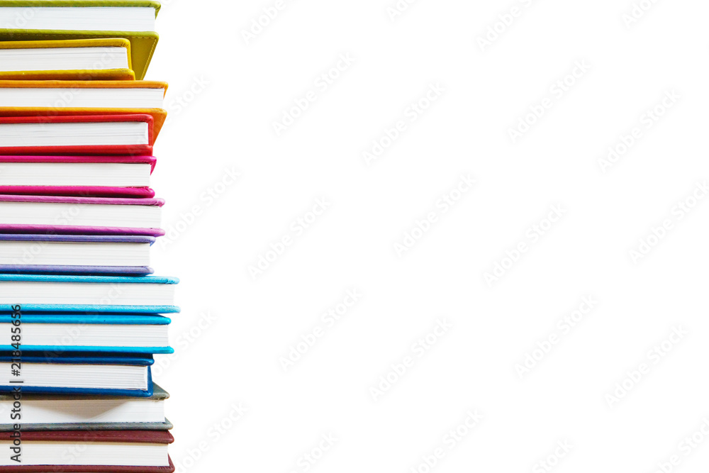 Books. A lot of books with bright covers in one pile isolated on white background. Place for text. Design element, paper and leather texture. Colorful books on the shelf, close up Books. A lot of books with bright covers in one pile isolated on white background. Place for text. Design element, paper and leather texture. Colorful books on the shelf, close up