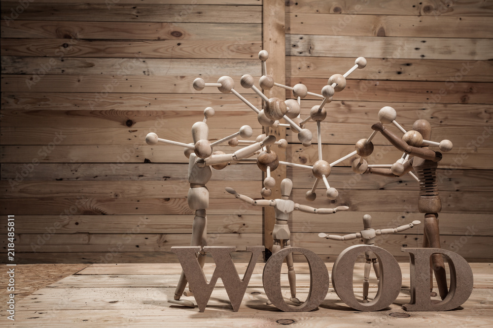 wooden dolls with wood text on wood table in wood scene wooden dolls with wood text on wood table in wood scene