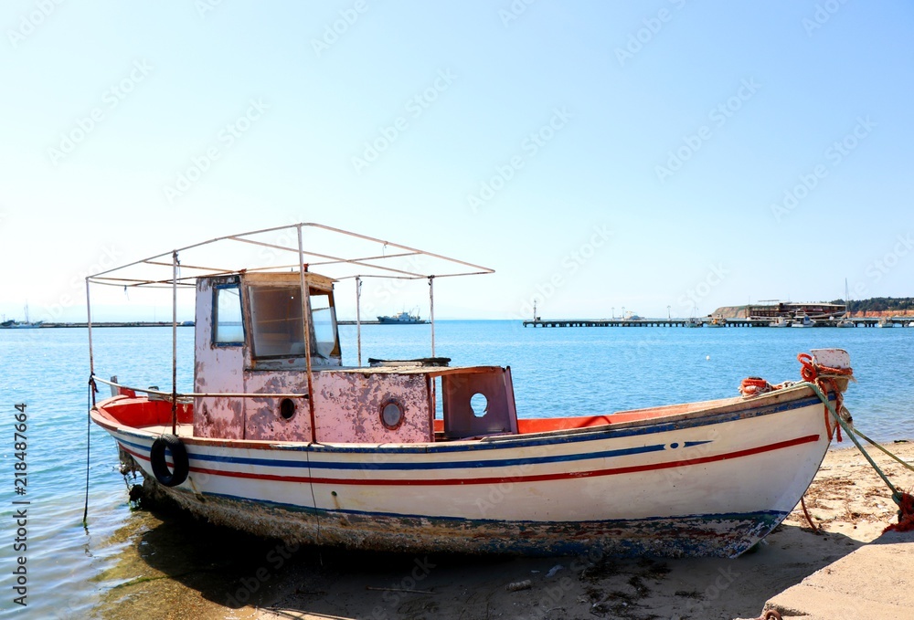 Old, abandoned fishing boat at Michaniona port. Thessaloniki, Greece