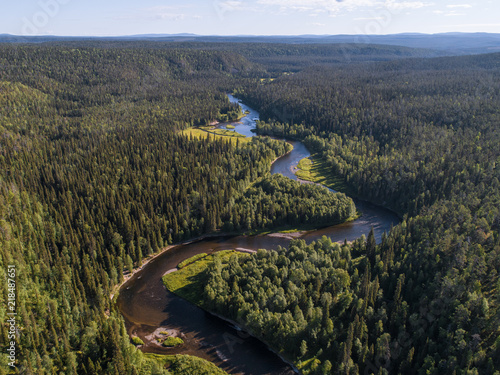 Aerial view of vast boreal aka taiga forest on sunny summer day in Oulanka National Park, Finland photo