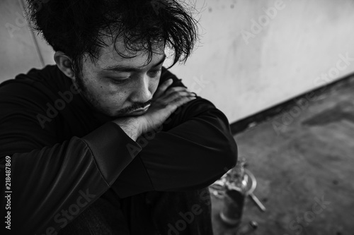 Men with depression from severe drug addiction photo