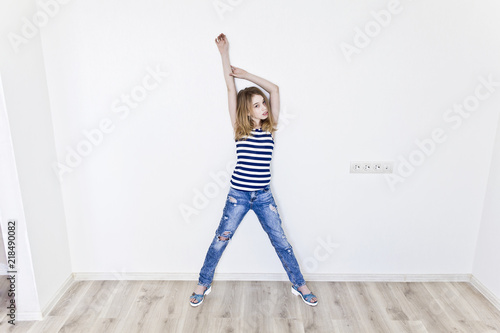 Cute girl with blond long hair on white photo