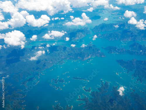 Top view landscape Island mountain and coast with blue sea ocean. View from airplane while flying over Andaman sea in Thailand.