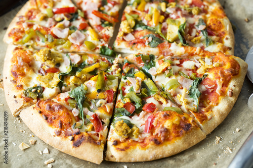 Pizza with chicken, bacon and vegetables 