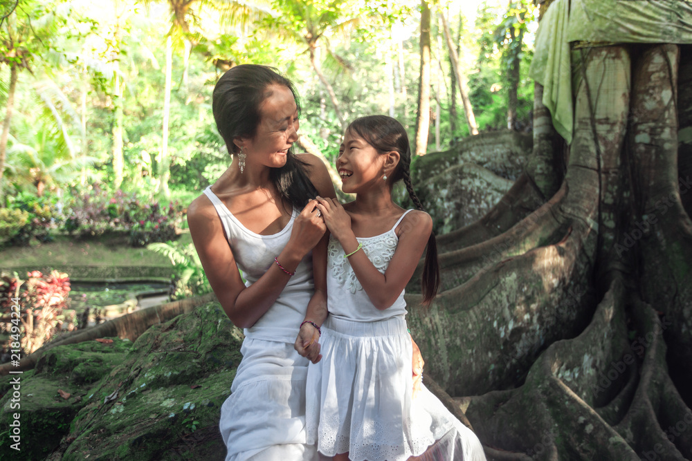 Mother with daughter spend time together in nature park Mother with daughter spend time together in nature park