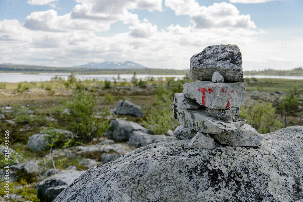 Stone cairn with marking, Norwegian mountains Stone cairn with marking, Norwegian mountains