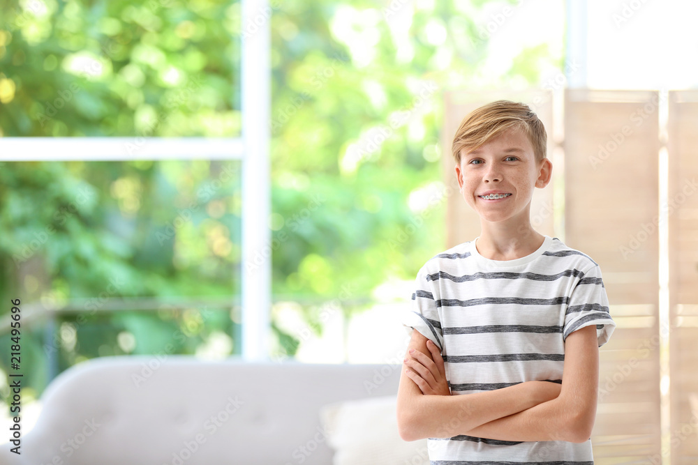 Portrait of young boy standing near window indoors Portrait of young boy standing near window indoors