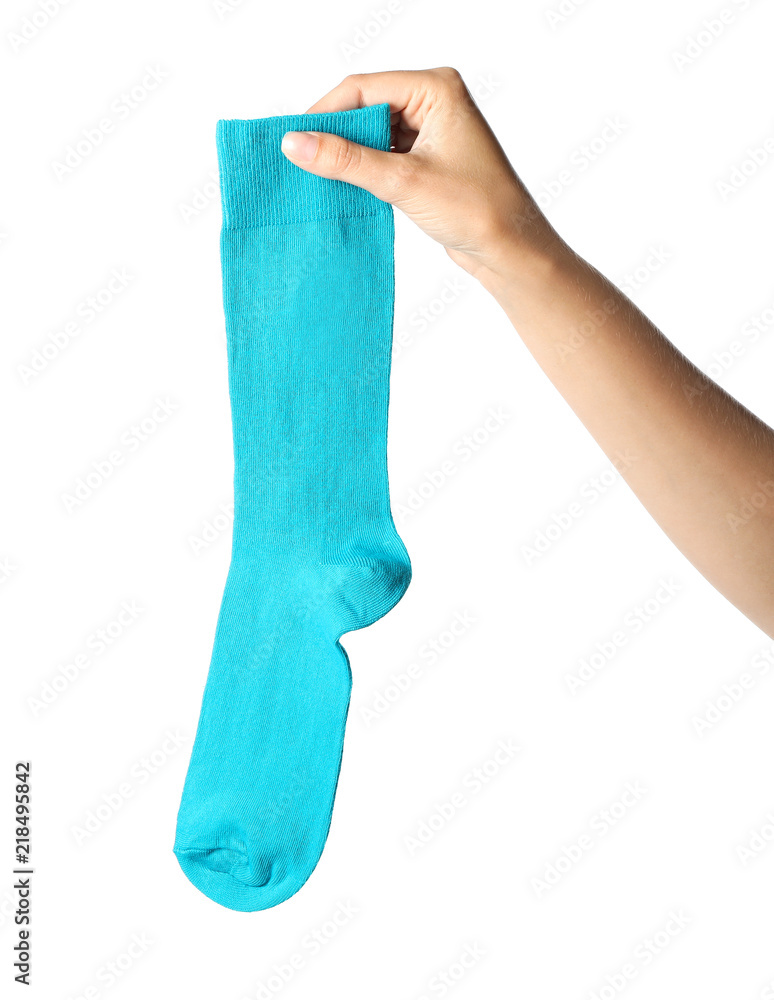 Woman holding colorful sock on white background Woman holding colorful sock on white background