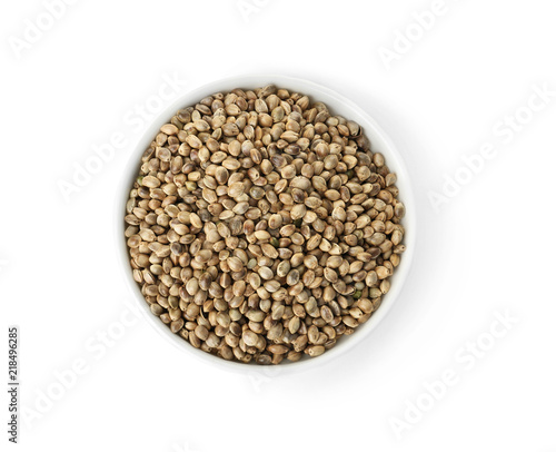 Bowl of hemp seeds on white background, top view