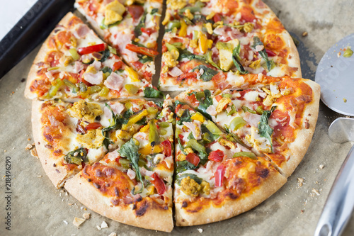 Pizza with chicken, bacon and vegetables 