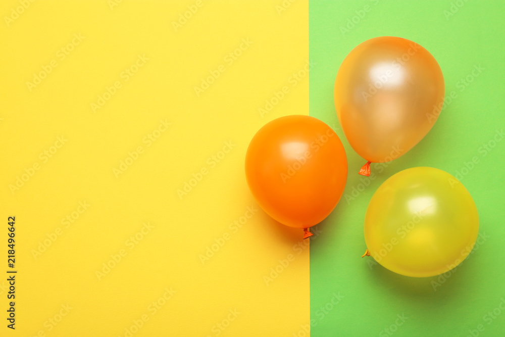 Flat lay composition with colorful balloons and space for text on color background Flat lay composition with colorful balloons and space for text on color background