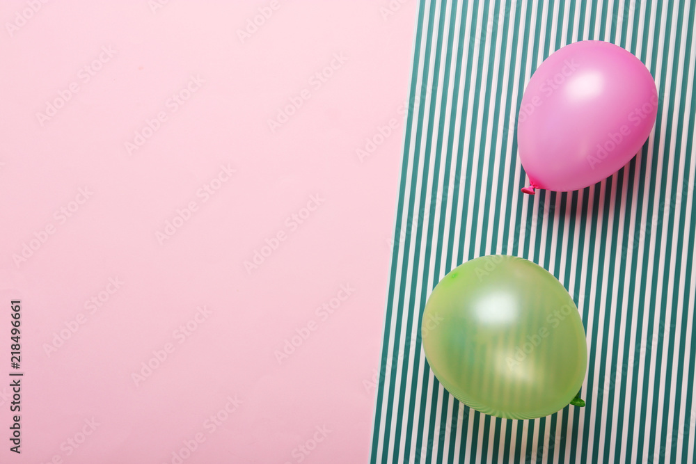 Flat lay composition with colorful balloons and space for text on color background