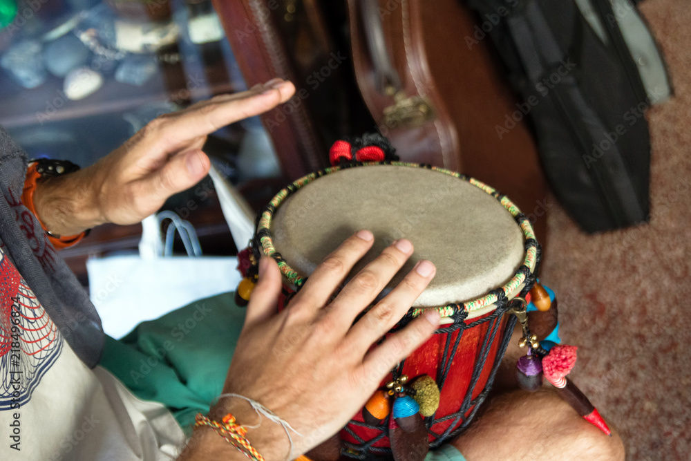 Fototapeta premium Hands of man playing African drum or djembe. Chiang Mai, Thailand.