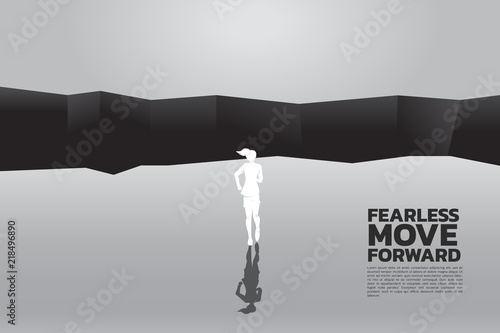 concept of business challenge and leadership. silhouette of businesswomen running to jumping over the gap. 