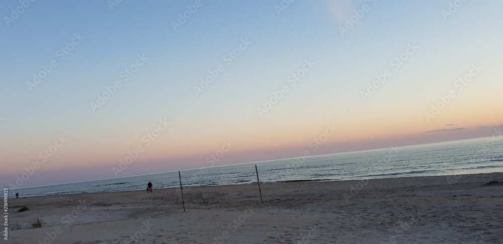 Baltic sea beach, seaside, coastline during sunset in summer’s evening.