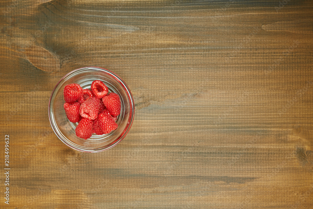 Fresh red raspberry on wooden background. Ingredients for cooking. Top view. Fresh red raspberry on wooden background. Ingredients for cooking. Top view.