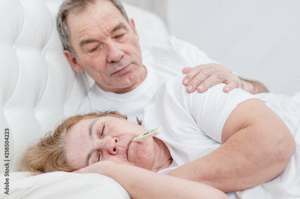 Senior man takes care of an senior woman Senior man takes care of an senior woman