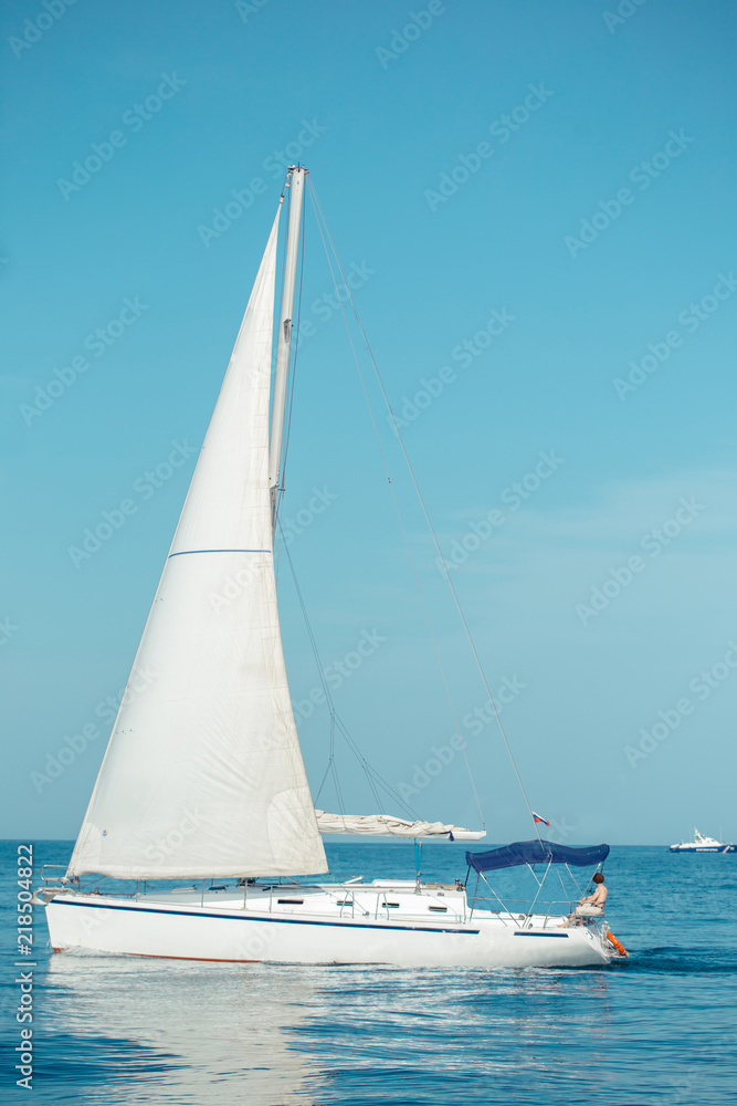 Beautiful luxury yacht with white sails is for those who truly know how to live.