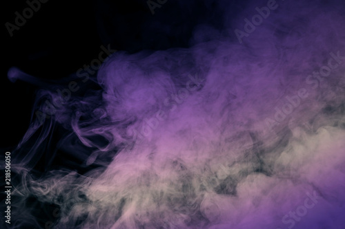 Abstract background, purple smoke on black backgroundn photo