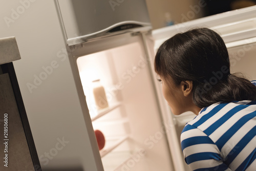 woman open a refrigerator