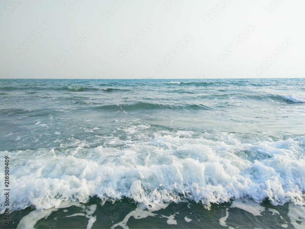Fototapeta premium Sand beach and sea wave foam on beach in Thailand