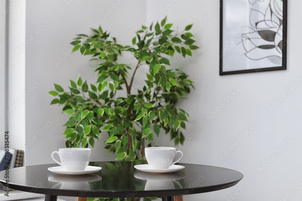 Tea cups on table indoors. Interior element Tea cups on table indoors. Interior element