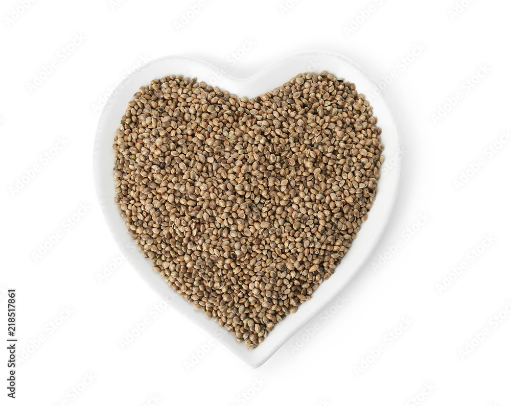 Plate with hemp seeds on white background, top view Plate with hemp seeds on white background, top view