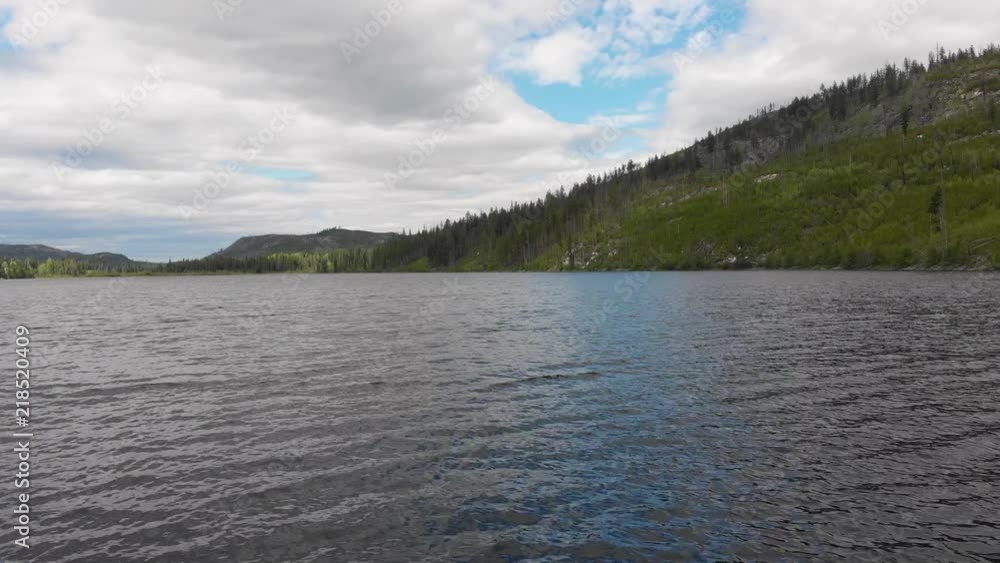 Aerial Drone Shot Flying Over Lake In Valley With Mountains Aerial Drone Shot Flying Over Lake In Valley With Mountains