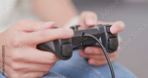 Woman playing video game at home