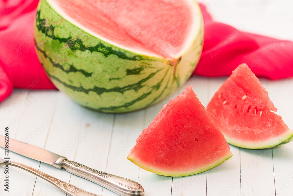 Red watermelon with with the elegant fork and knife